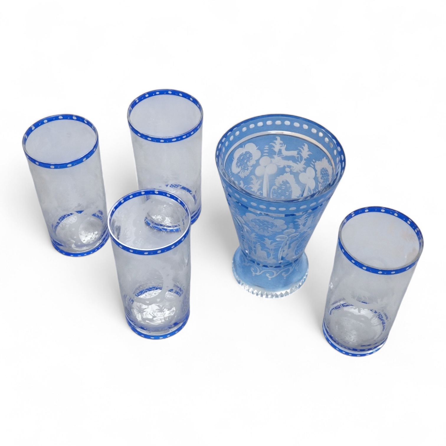 A German engraved blue flashed glass vase and four similar beakers, late 19th/early 20th century, beaker 15cm high.
